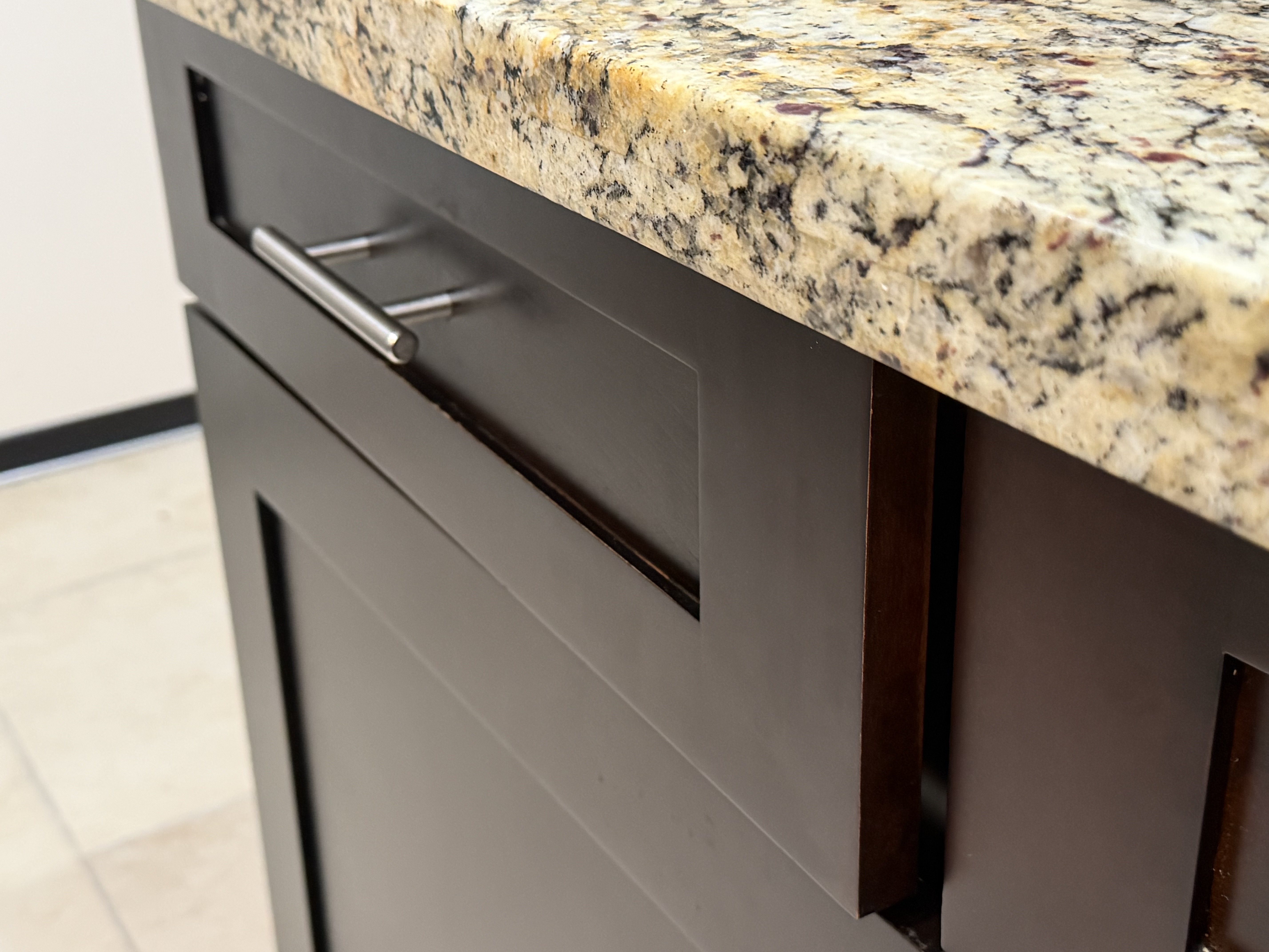 Close-up of a freshly installed granite countertop and custom cabinetry finished by Grayhawk Handyman in the East Valley